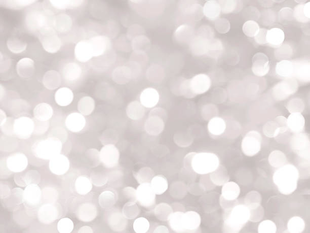 istock Bright silver bokeh background, blurred, silver, white circles, spots, holiday, Christmas, gray, white, glitter, beautiful 1071633882