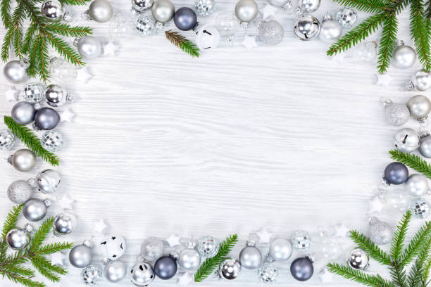 istock new year holidays frame decor. white wooden background with christmas tree branches and glass balls 1071635230