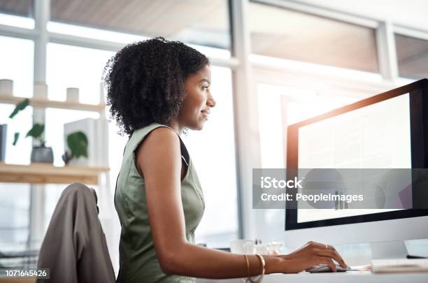 Handling Her Workload With Ease Stock Photo - Download Image Now - Computer Monitor, Looking, Device Screen