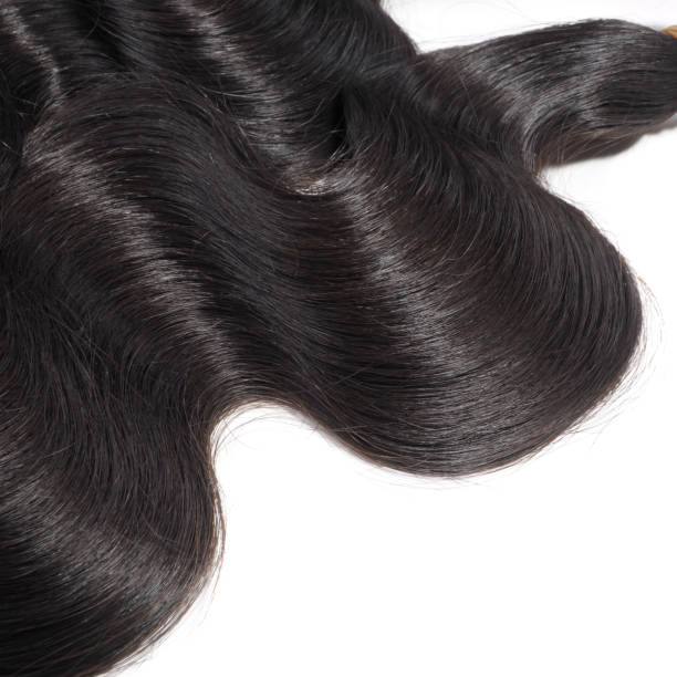 istock Body wavy black human hair weaves extensions 1071651726