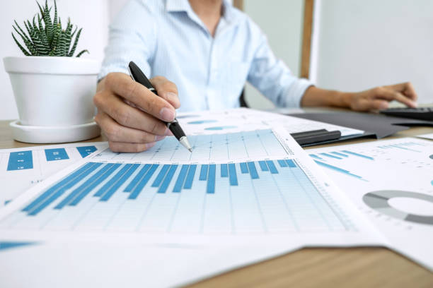 istock Businessman accountant making working audit and calculating expense financial annual financial report balance sheet statement, doing finance making notes on paper checking inspection 1071652024
