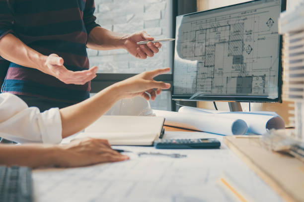 istock Image of engineer or architect partner meeting for working with architectural project, drawing and sketching for inspection architectural project on blueprint at workspace 1071652056