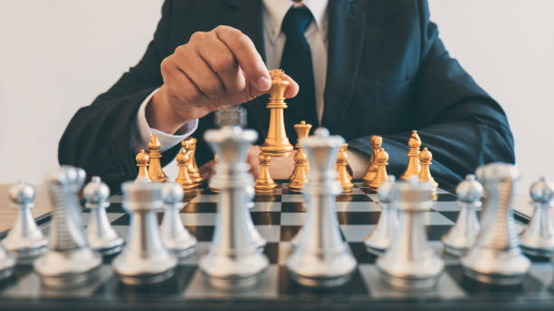 istock Businessman leadership playing chess and thinking strategy plan about crash overthrow the opposite team and development analyze for successful of corporate 1071652064