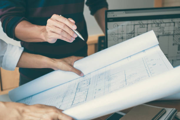 istock Team of Construction engineering or architect hands working on blueprint inspection in workplace, drawing and sketching meeting for architectural project working with partner 1071652446
