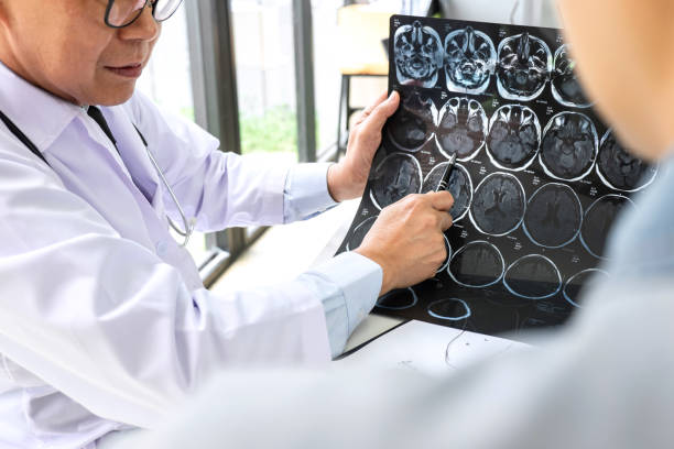 istock Professor Doctor having conversation with patient and holding x-ray film while discussing explaining her symptoms or counsel diagnosis health, healthcare and assistance concept 1071652496