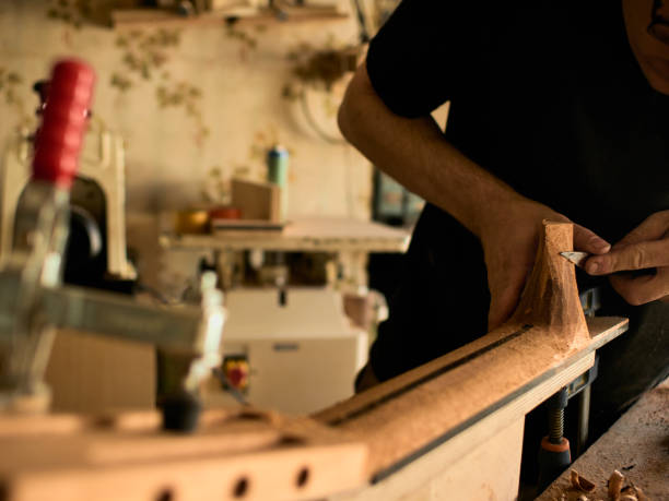 istock The guitar master makes a guitar neck. 1071654066