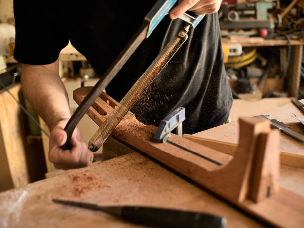istock The guitar master makes a guitar neck. 1071654072