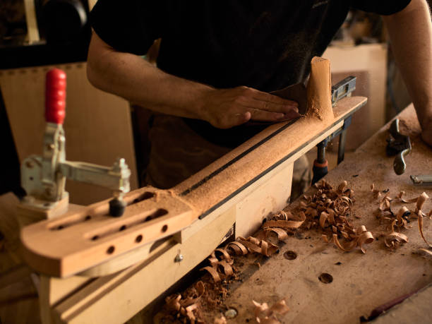 istock The guitar master makes a guitar neck. 1071654086