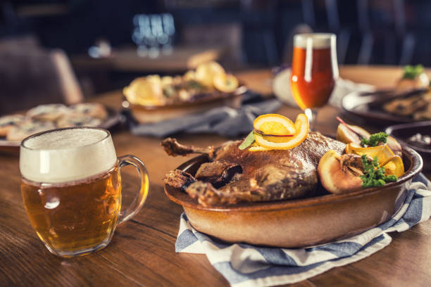 Roasted christmas duck red cabbage dumplings liver draft beer and baked buns.