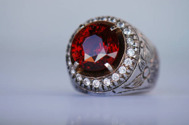 Gemstones Natural Color Orangish Red Garnet Stone and Ring. garnet stock pictures, royalty-free photos & images