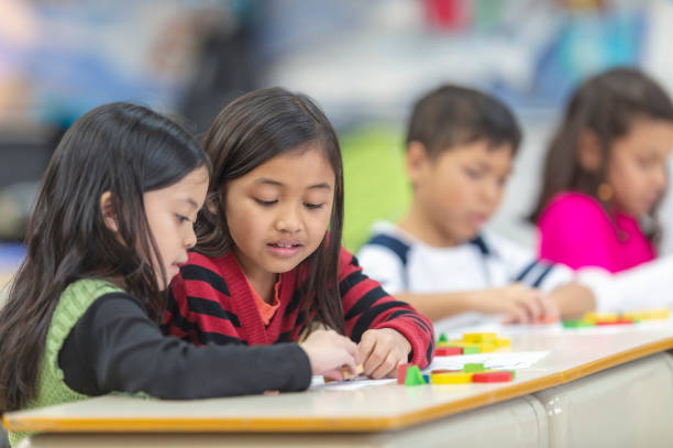 istock Schoolgirls playing in class 1071670102