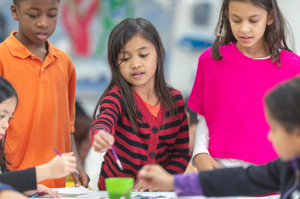 istock Kids painting in art class 1071670114