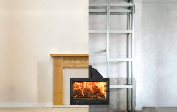 istock Modern fireplace in the apartment interior with real fire. Process installation 1071672016