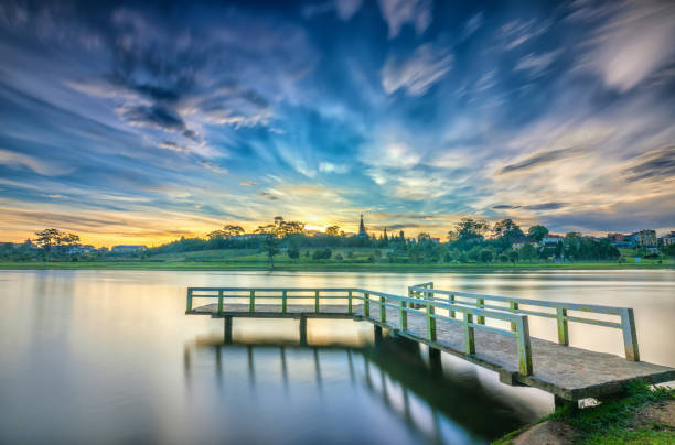istock Sunrise on the small bridge overlooking the lake with the dramatic sky 1071685444