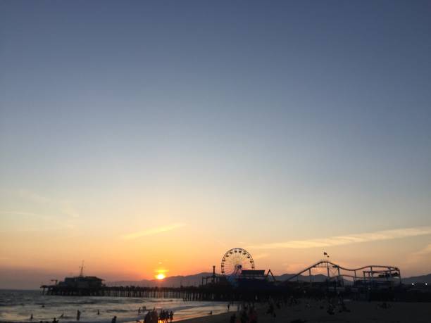 istock Santa Monica sunset against amusement park 1071688174