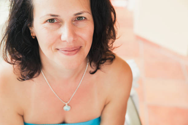 istock Caucasian woman looks directly in camera 1071691858