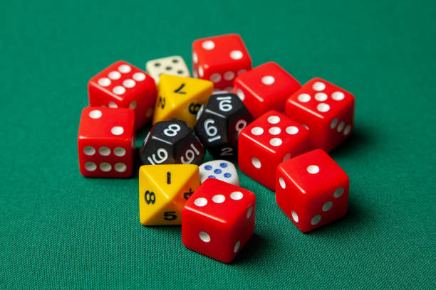 istock Collection of colored gaming dice cubes on green table 1071692074