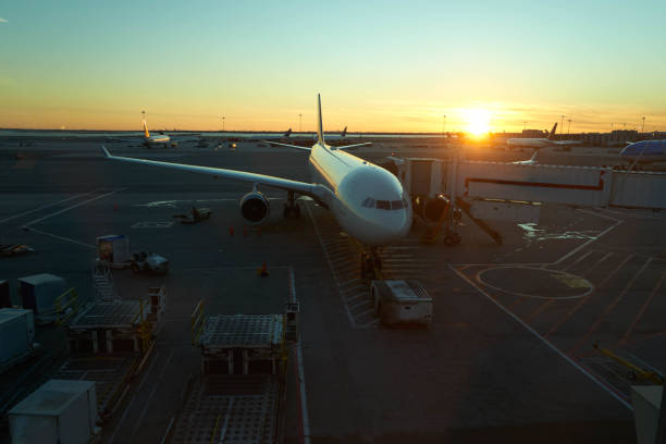 istock Docked Plane at airport on sunset 1071712432