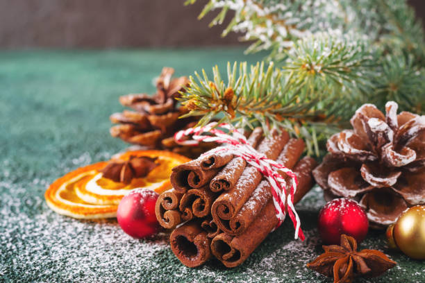 istock Christmas natural composition with cinnamon, pine cones and dry oranges 1071712712