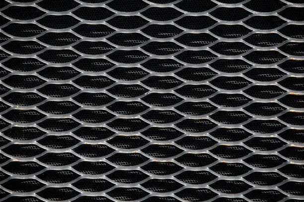 Tractor radiator grille for design and background. Abstract metallic mesh background.