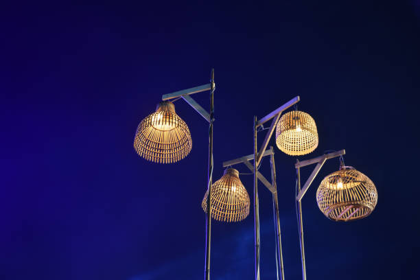 istock four Thai ancient wooden lamp and blue light with night sky background 1071715204