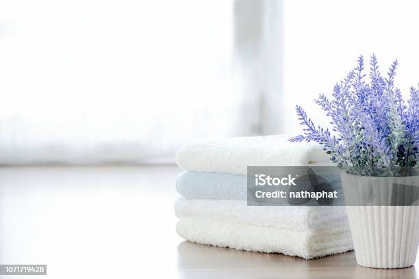 Mockup Stack Of Towels And Houseplant On White Table With Copy Space Stock Photo - Download Image Now