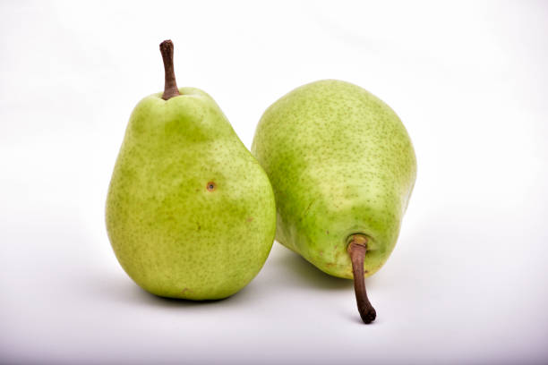 istock two organic pears isolated on white background 1071722722