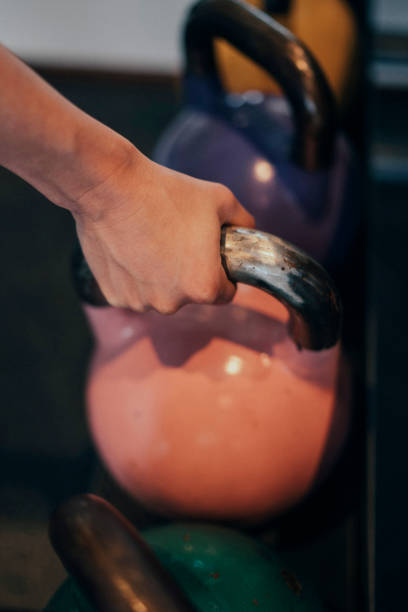 istock Woman grips a kettlebell 1071725434