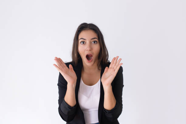 istock Shocked pretty Caucasian girl spreading hands 1071729580