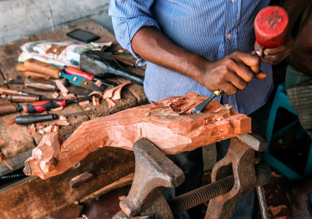 istock the master makes wooden figures 1071733634