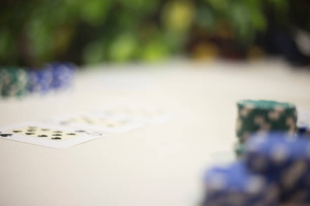 Gambling Chips .d Poker Cards on Table