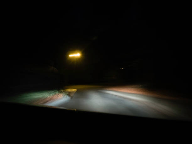 istock moving road at night shot through the windshield 1071738042
