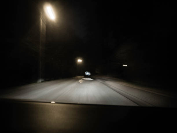 istock moving road at night shot through the windshield 1071738060