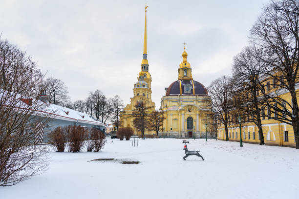 Peter and Paul Cathedral on island in center of Fortress in winter. Saint Petersburg, Russia Cathedral on island in the center of Peter and Paul Fortress in winter in Saint Petersburg, Russia peter and paul cathedral st petersburg stock pictures, royalty-free photos & images
