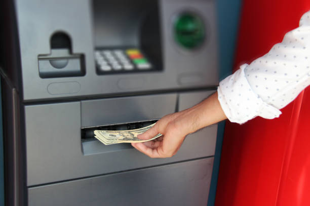 istock Cash withdrawal at ATM in dollar 1071744174