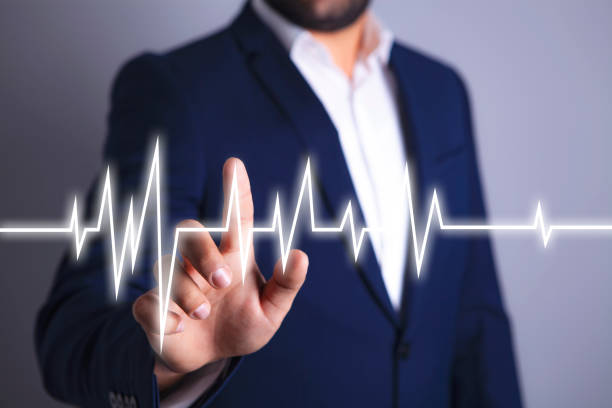 istock businessman shows a cardiogram 1071746282
