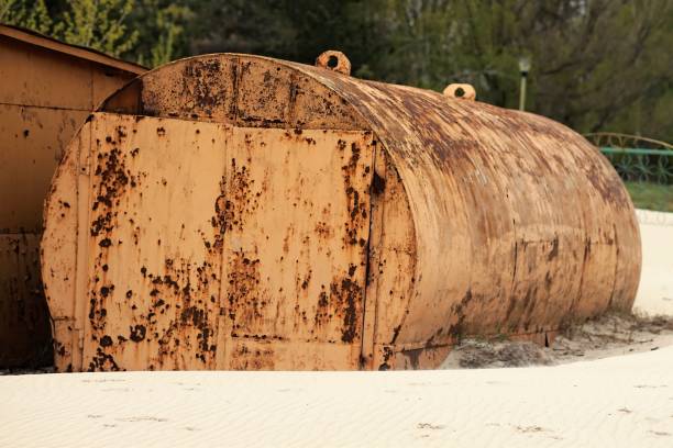yellow rusty abandoned tank lying on the beach