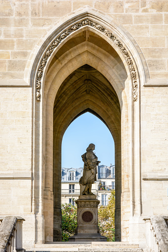 Statue of french scientist of the 17th century Blaise Pascal, made by french sculptor Pierre-Jules Cavelier in 1854, installed at the base of Saint-Jacques tower in Paris, France.