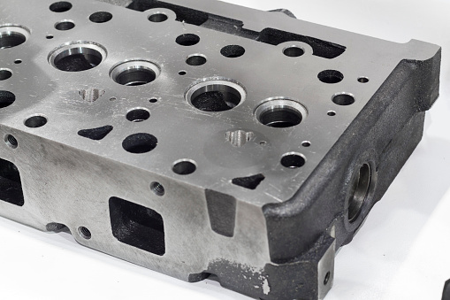 As machined head cylinder from iron casting ; close up