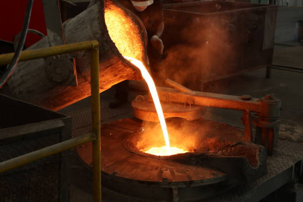 istock Molten iron pour from ladle into melting furnace 1071751274