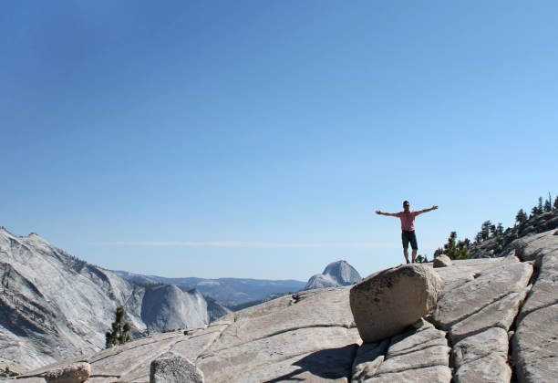 istock Man with raised arms in front of Yosemite panorama 1071763972