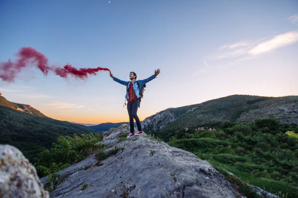 istock Young man on top of the mountain 1071765652