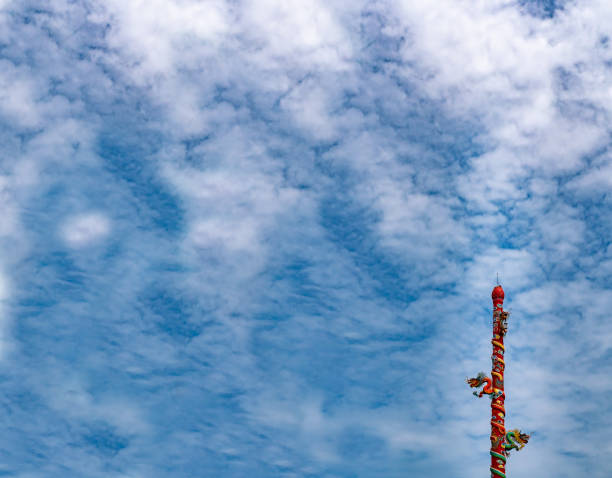 istock The dragon statue  on post with a sky background and a cloud. 1071765936