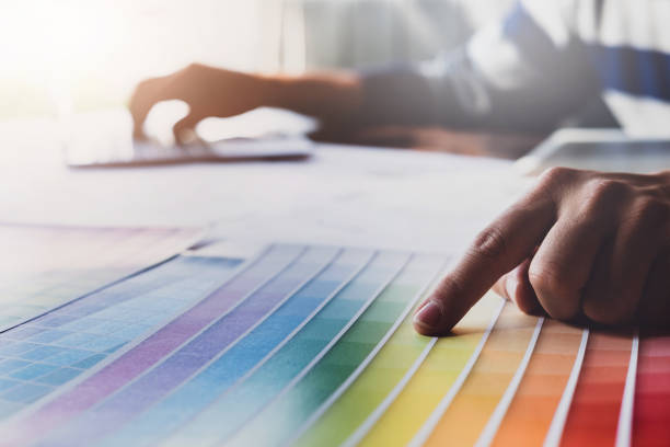 istock corporate designer graphic creative creativity concept ,man using pen, laptop computer to create graphic design coloring colour ideas style house to order customer. 1071770952