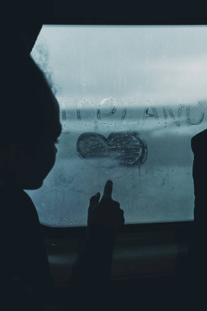 istock Woman writing on misted window in car 1071778398