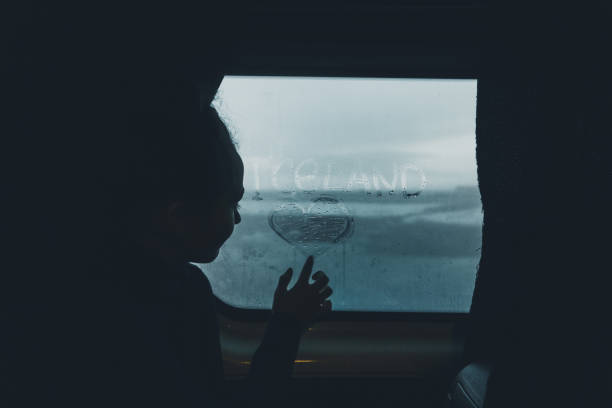 istock Woman writing on misted window in car 1071778426