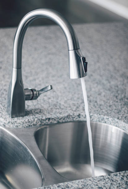 istock Kitchen Faucet Sink 1071779642