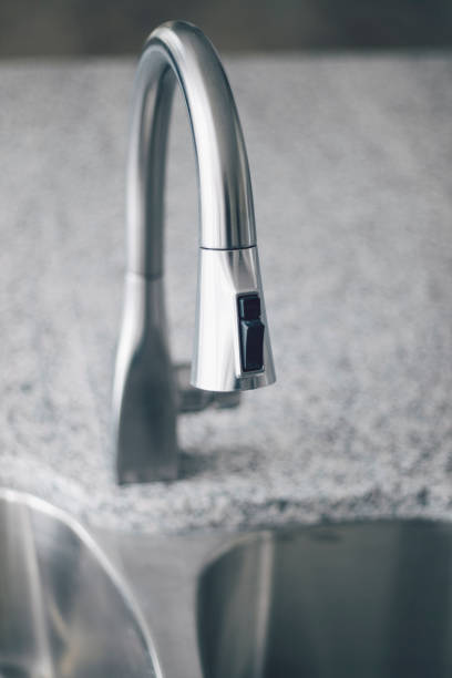 istock Kitchen Faucet Sink 1071779646