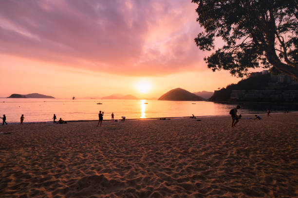 istock Silhouette of People on Sunset Beach 1071781080