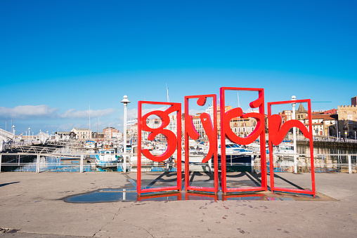 Gijon, Spain - November 19, 2018: Famous red symbol monument in marina of Gijon, Asturias, Spain.